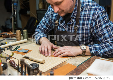 Concept of handmade craft production of leather goods. 57070959