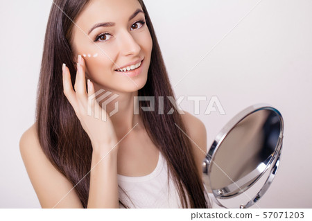 Beautiful woman face close up studio on pink. Picture of beautiful woman beautiful woman in spa Beautiful woman face close up studio on pink. Picture of beautiful woman beautiful woman in spa 57071203