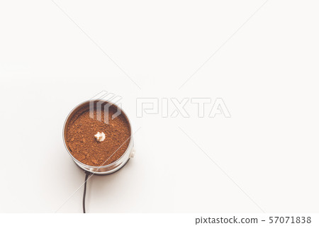 Close up coffee beans in coffee grinder. Espresso Close up coffee beans in coffee grinder. Espresso 57071838
