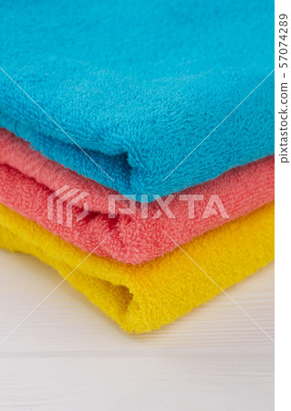 Stack of colorful bath towels close up. 57074289