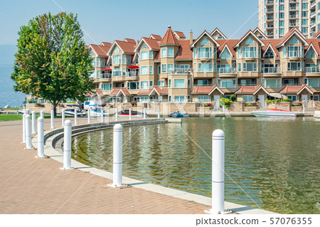 Luxury residential building with boat pier at the entrance in British Columbia Luxury residential building with boat pier at the entrance in British Columbia 57076355