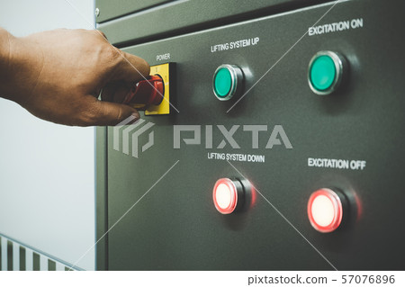 Close up of Worker hand turn on the main switch Close up of Worker hand turn on the main switch 57076896