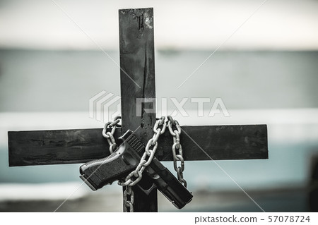 Black cross with a looped chain. 57078724