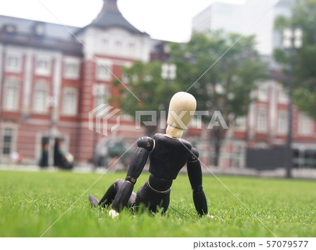 Businessman taking a break on the lawn Businessman taking a break on the lawn 57079577