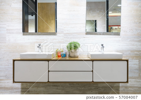 bathroom interior with double sinks and mirrors in elegant home interior bathroom interior with double sinks and mirrors in elegant home interior 57084007