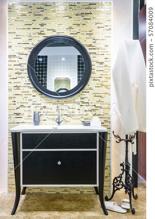Interior of bathroom with sink basin faucet and mirror Interior of bathroom with sink basin faucet and mirror 57084009