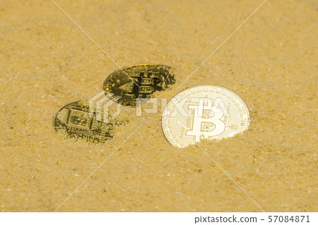bitcoin on golden sand 57084871