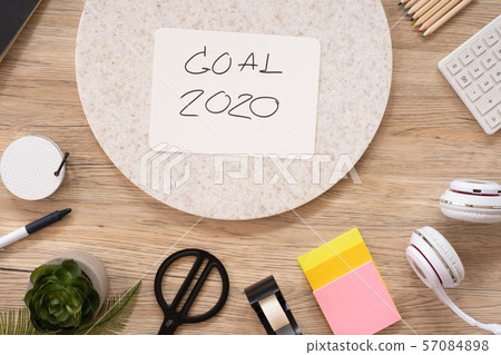 new year goal 2020 on paper top view at wood 57084898