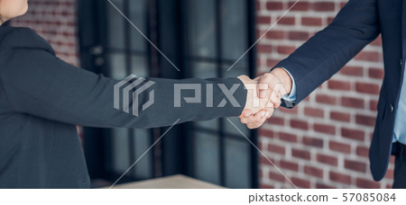 close up hand businessman and businesswoman close up hand businessman and businesswoman 57085084