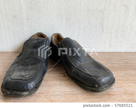 old vintage leather shoe put on wooden 57085521