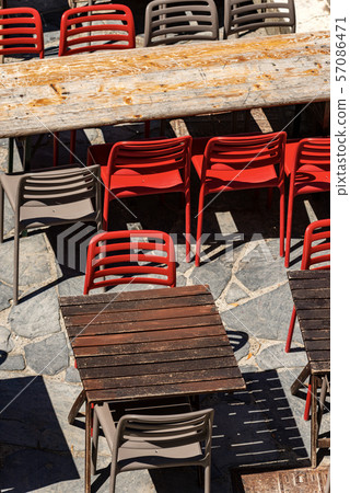 Empty restaurant tables and chairs - Liguria Italy Empty restaurant tables and chairs - Liguria Italy 57086471