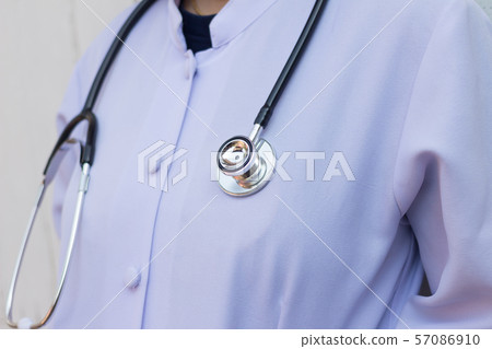 Medical doctor woman or physician in white gown Medical doctor woman or physician in white gown 57086910