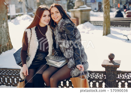 Two girls in a city 57090036