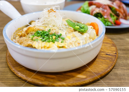 Katsudon or Japanese style fried pork roast with egg and Japanese ingredient mixed on rice 57090155