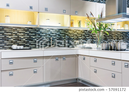 Bright modern kitchen with stainless steel appliances Bright modern kitchen with stainless steel appliances 57091172