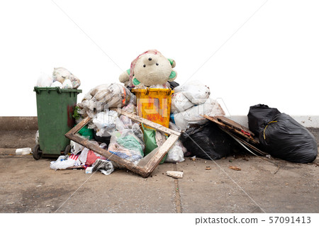 Teddy bear on the garbage pile isolated in white background. 57091413