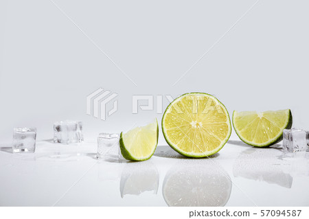Ice cubes and lime wedge 57094587