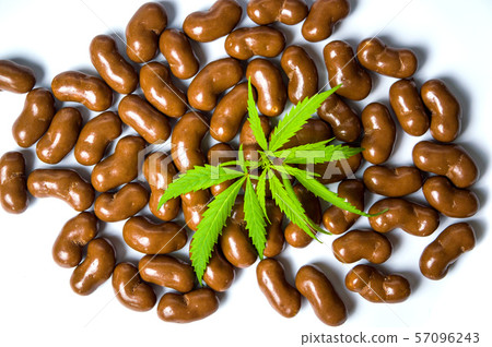 Chocolate candy with marijuana plant top view 57096243
