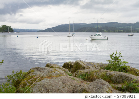 View from Ambleside lake shore of boats and sea-gulls in Ambleside , Lake Windermere, UK View from Ambleside lake shore of boats and sea-gulls in Ambleside , Lake Windermere, UK 57099921