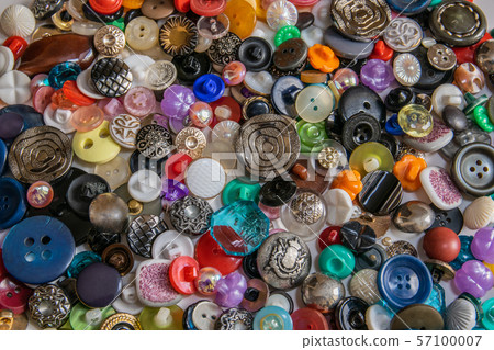 many scattered old color buttons. Buttons for 57100007