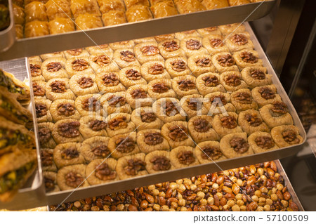 Traditional delicious turkish dessert baklava in the shop window showcase. Different kinds of Traditional delicious turkish dessert baklava in the shop window showcase. Different kinds of 57100509