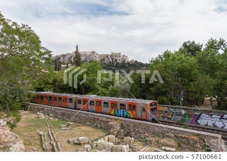 Passing train through Athens Ancient Agora with Acropolis in the background Passing train through Athens Ancient Agora with Acropolis in the background 57100661