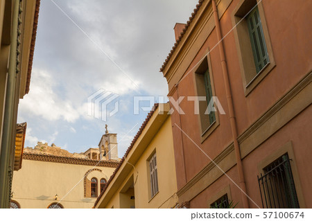 Plaka district in Athens Greece, with Church and  the Acropolis in the background 57100674