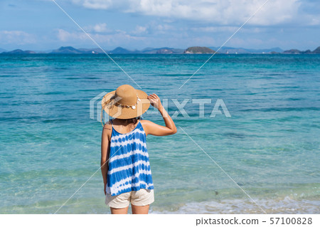 Young woman relaxing and enjoying at the tropical 57100828