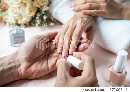 Beautiful manicure nails paint with glitter and Beautiful manicure nails paint with glitter and 57100844