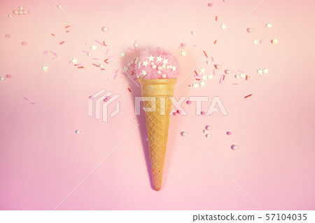 Colorful sprinkles on a pink background, top view with copy space 57104035
