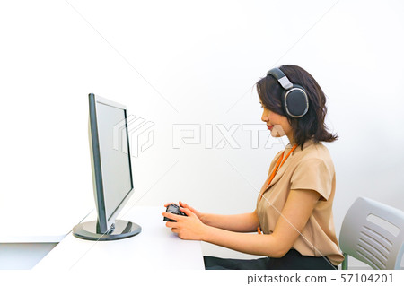 Image of operator work: Image of female staff performing remote control using a controller in the work room Image of operator work: Image of female staff performing remote control using a controller in the work room 57104201