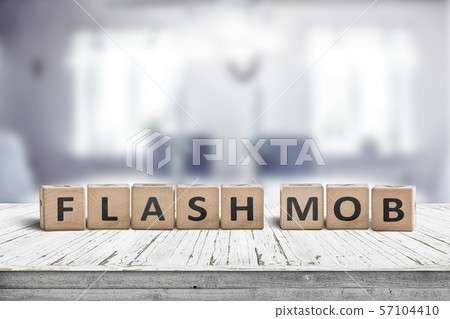 Flash mob message sign on a table in a bright room Flash mob message sign on a table in a bright room 57104410