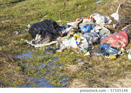 Pile of garage on green grass in the nature Pile of garage on green grass in the nature 57105146