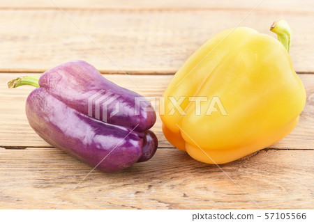 Purple and orange fresh bell peppers 57105566
