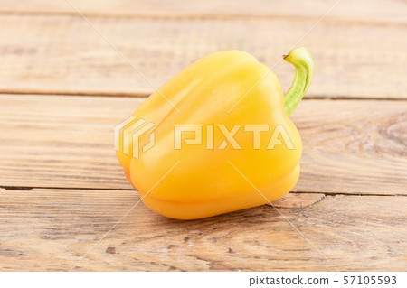 Fresh orange sweet pepper on wooden background. Fresh orange sweet pepper on wooden background. 57105593