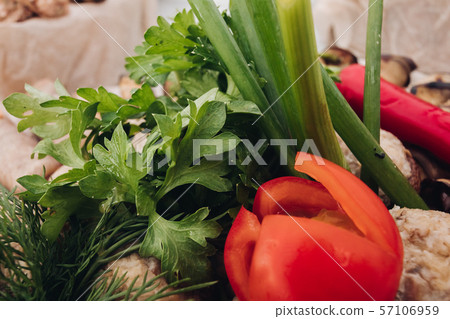 Close-up of fresh greenery and tomato.Close-up of Close-up of fresh greenery and tomato.Close-up of 57106959