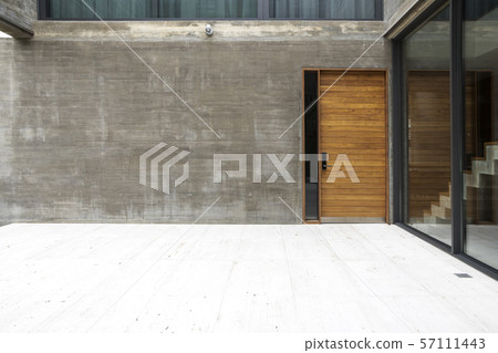 Wooden doors and bare cement walls and glass Wooden doors and bare cement walls and glass 57111443