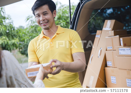 Young Asian Delivery man delivering packages 57111578