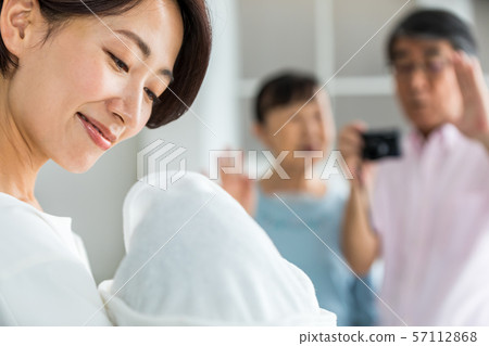 Daughter and baby having their parents take pictures 57112868