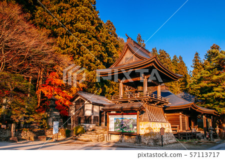 Vibrant colourful maple tree and Shoro bell tower 57113717
