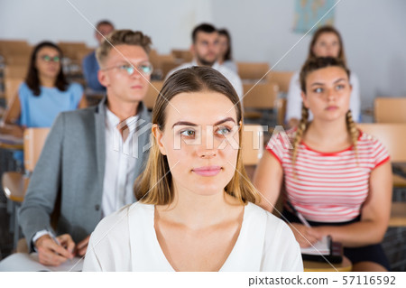 Woman listening to lecture 57116592