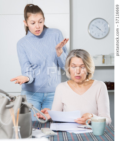 Unhappy woman with documents, family quarrel 57116669