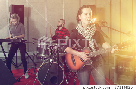Beautiful guitar player and singer with band 57116920