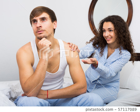 Wife wheedling forgiveness from husband after argue Wife wheedling forgiveness from husband after argue 57117089
