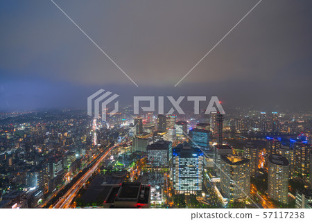 Yokohama cityscape in Japan Local heavy rain and thunderstorms. The surrounding sky was stained pale with dark clouds and flashes = observed from Yokohama city Yokohama cityscape in Japan Local heavy rain and thunderstorms. The surrounding sky was stained pale with dark clouds and flashes = observed from Yokohama city 57117238