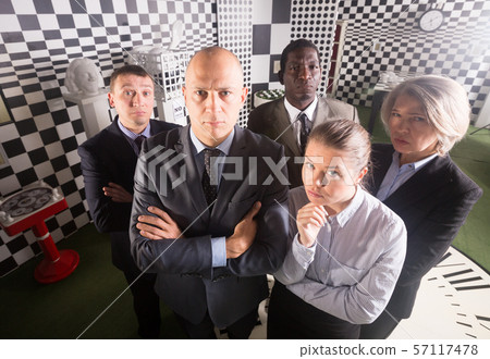 Suspicious businessmen Suspicious businessmen 57117478