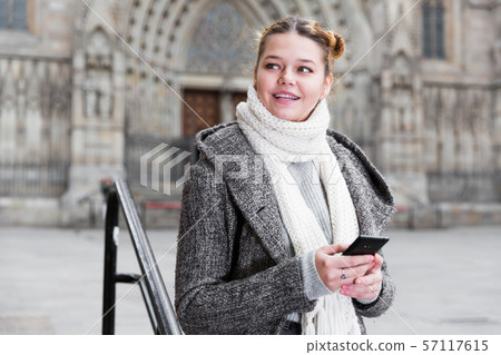 positive girl teenager with phone 57117615