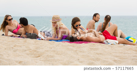 People sunbathing on the beach 57117665