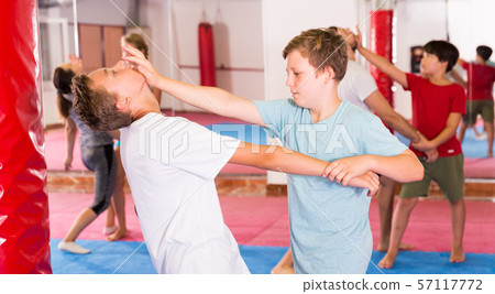 Kids exercising self-defense movements 57117772
