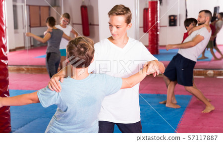 Kids exercising self-defense movements Kids exercising self-defense movements 57117887